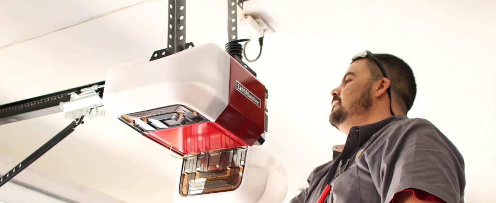 Technician repairing a garage door opener